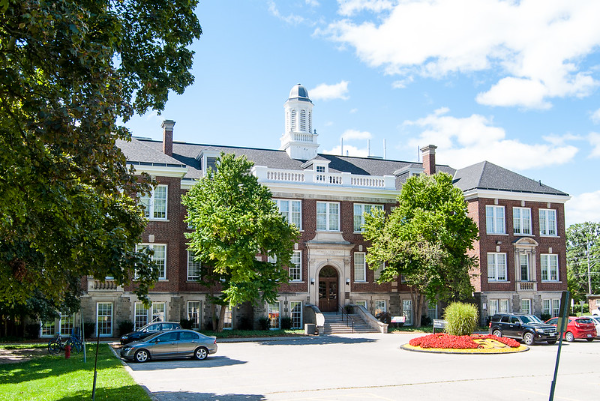 OVC main building with cars parked out front